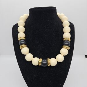 vintage cream beaded necklace with black and gold tone accents